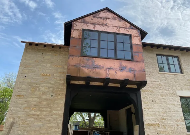 Copper metal panel facade on a stone building for Metal Roof Coating in Rock Falls