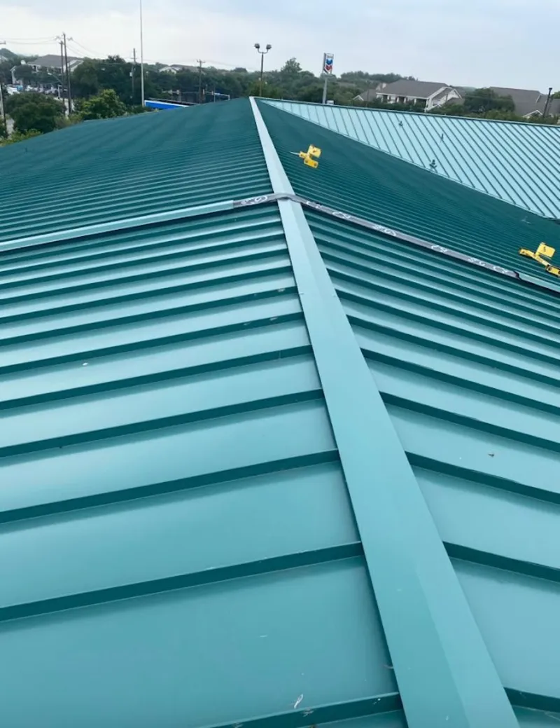 Green commercial metal roof ridge and valley for Metal Roof Repair in Rock Falls
